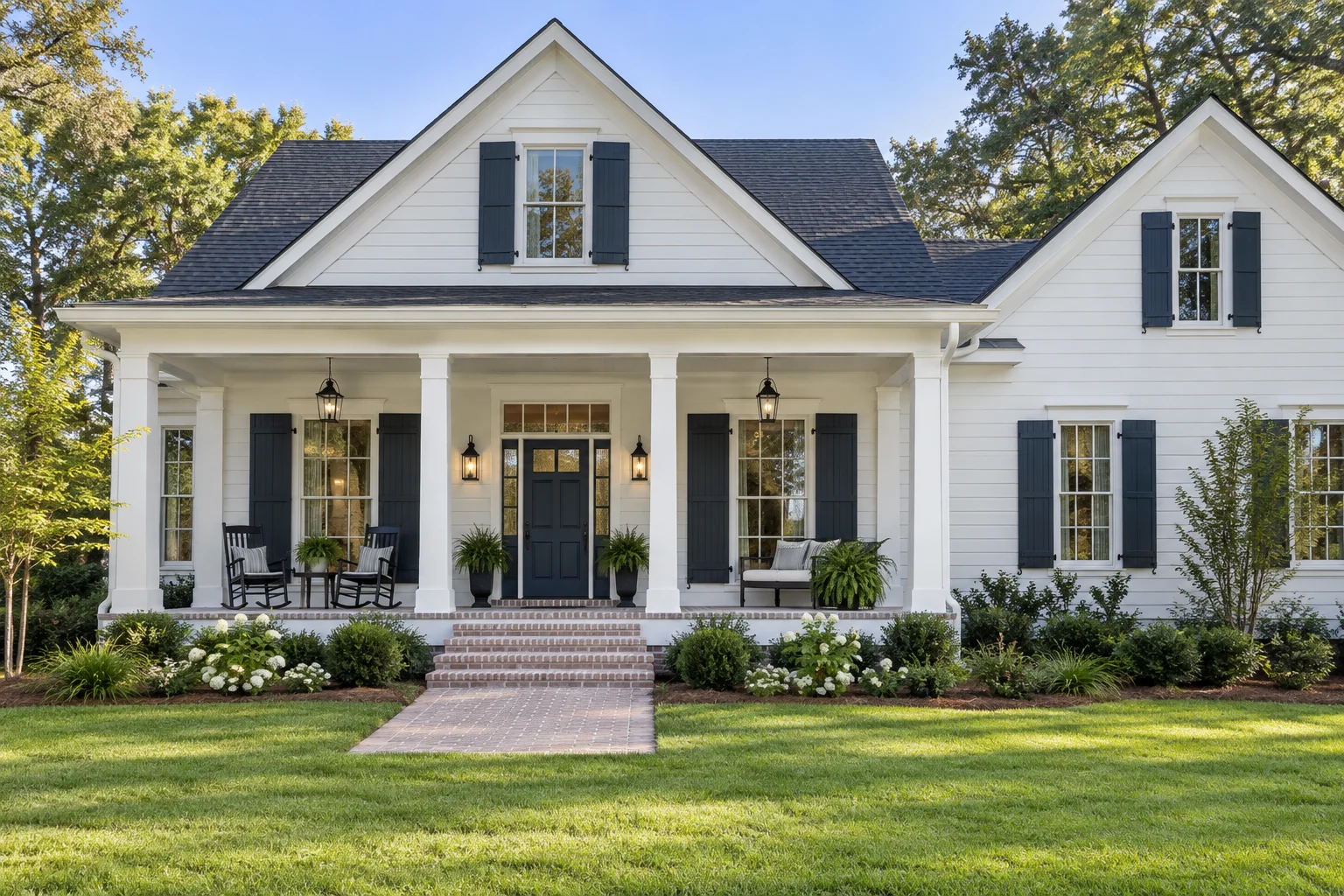 Representative white home exterior with crisp porch trim and a navy front door